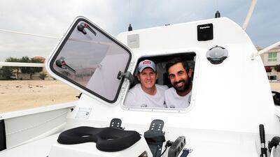 Oliver Amos, left, and Paris Norriss in the cabin of their rowing boat in Dubai. All photos: Pawan Singh / The National