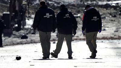 Investigators work near the site of an explosion on 2nd Avenue that occurred the day before in Nashville, Tennessee, U.S. REUTERS