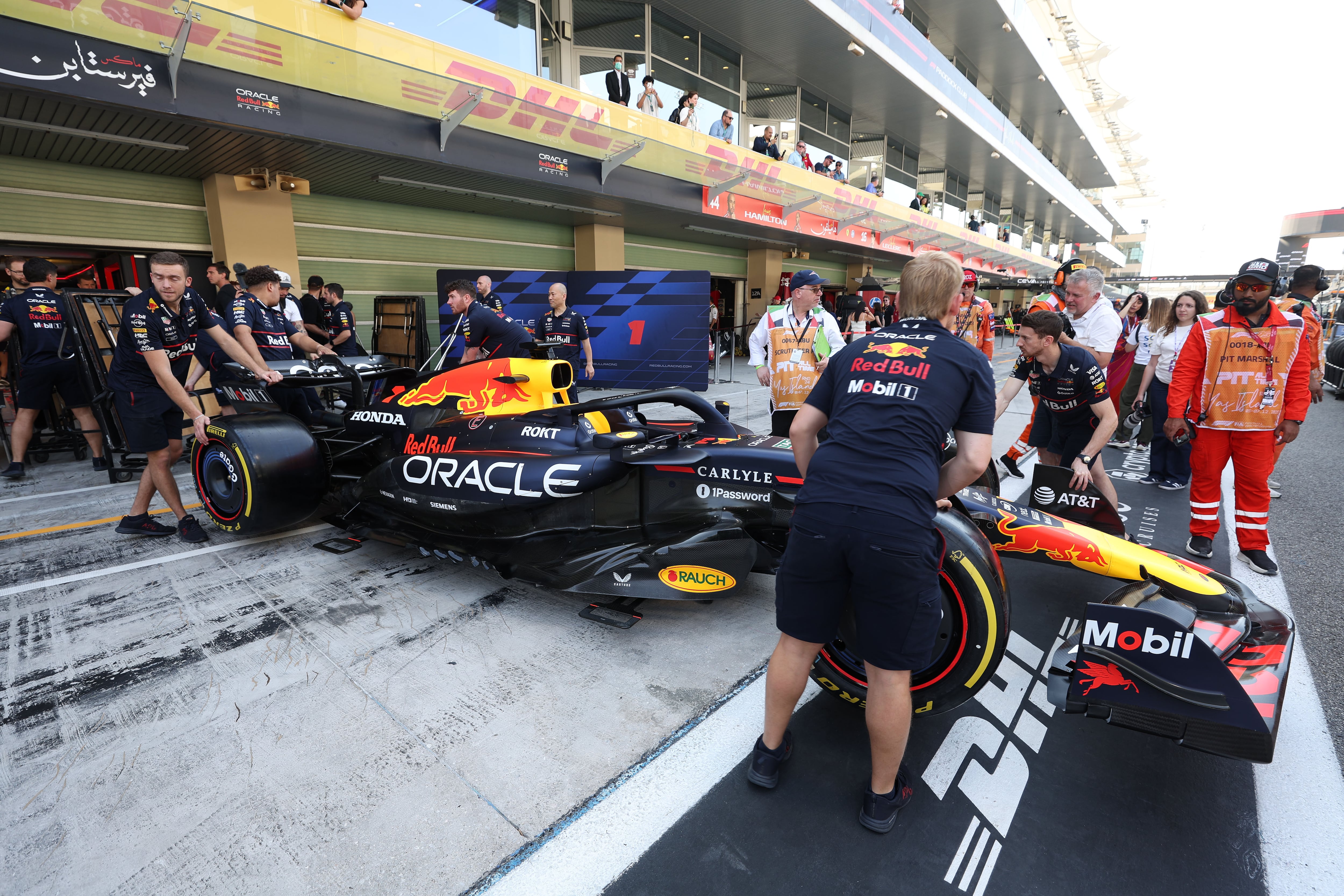 The Red Bull team move Max Verstappen's car on race day at Yas Marina Circuit