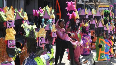 A vendor selling effigies of the demon King Ravana waits for customers on the eve of Dussehra, the last day of Navratri, in Amritsar. AFP