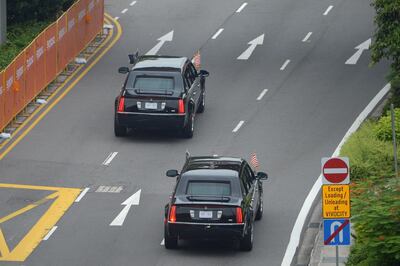The motorcade carrying US president Donald Trump sets off to Sentosa. AFP/Ted ALJIBE