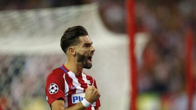 Atletico Madrid’s Yannick Carrasco celebrates scoring the opening goal. Daniel Ochoa de Olza / AP Photo
