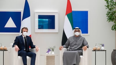 Sheikh Mohamed bin Zayed and President Emmanuel Macron witness a signing ceremony for various agreements. Photo: Ministry of Presidential Affairs