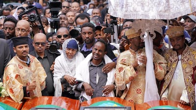 Family members of Captain Yared Getecho mourn in front of his coffin during a memorial service for the Ethiopian passangers and crew who perished in the Ethiopian Airways ET302 crash. The airline said pilots were trained on the new Max jet. Getty
