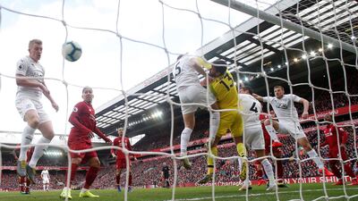 Burnley's James Tarkowski in action with Liverpool's Alisson as Burnley's Ashley Westwood (not pictured) scores direct from a corner. Reuters