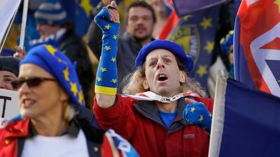 Anti Brexit campaigners demonstrate in Westminster in London, Monday, Nov. 19, 2018. The EU nations and Britain are still negotiating the outline text of a draft Brexit deal, setting out their future relationship which will have to be ratified by both the British and the European Parliaments. (AP Photo/Kirsty Wigglesworth)