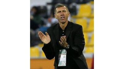 Srecko Katanec, the UAE coach, shouts instructions to his team last night. Hassan Ammar / AP Photo