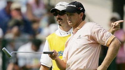 Retief Goosen, the South African, confers with his caddie Colin Byrne during the 2005 US Open. Byrne said the art of caddying is ‘understanding whom your dealing with’ and ‘what would motivate them.’