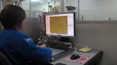 Fernanda Costa, one of three staff at the Casa da Moeda in charge of electronic design, edits the image of Nike before sending the final design to be cast. Gary Meenaghan for The National