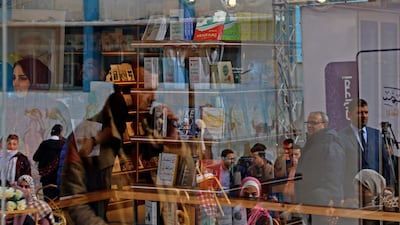 Palestinians attend the reopening of the new Samir Mansour bookshop after it was destroyed during last year's 11-day war between Israel and the Palestinian Hamas movement, in Gaza City. Mansour's beloved bookshop has been rebuilt and restocked following an international fundraiser.