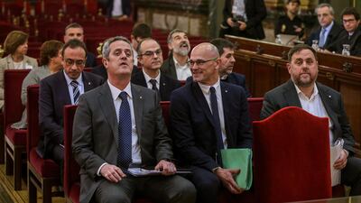 Former regional Vice President Oriol Junqueras (R), former regional Foreign Minister Raul Romeva (C), regional Minister of Interior Joaquim Forn (L) and other nine other accused are seen at the start of the so-called 'process' trial against 12 Catalan pro-independence politicians. EPA