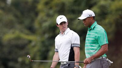 Based on their performances last time out, Rory McIlroy, left, not world No 1 Tiger Woods, is considered the favourite heading into Thursday’s Dubai Desert Classic. McIllroy was second in Abu Dhabi two weeks ago. Lintao Zhang / Getty Images