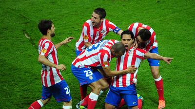 Atletico Madrid's Colombian forward Radamel Falcao (2nd R) celebrates with his tesammates after scoring the 2-0 during the UEFA Europa League final football match between Club Atletico Madrid and Athletic Club Bilbao on May 9, 2012 at the National Arena stadium in Bucharest. AFP PHOTO/DANIEL MIHAILESCU