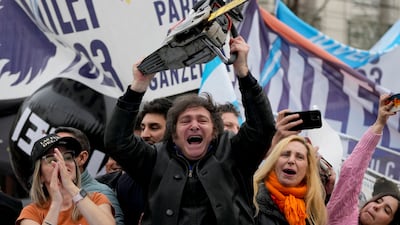 Javier Milei brandishes a chainsaw during a campaign rally in La Plata, Argentina, in September. AP