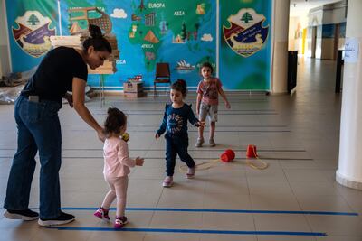 Children play in a school where they are sheltering from Israeli airstrikes in the Lebanese Christian border town of Rmaich on October 9. The future of societies depends on creating environments where every child can thrive. Getty Images