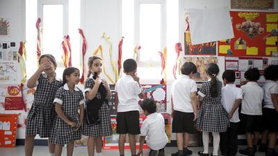 Children line up as they prepare to change classrooms at the Brighton College in Abu Dhabi. Silvia Razgova / The National