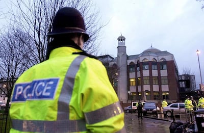 A police officer stands in front of Finsbury Park Mosque in London. EPA