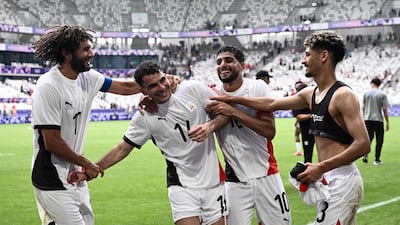 Egypt's Mohamed Elneny, Ahmed Zizo, Ibrahim Adel and Ahmed Atef celebrate their 2-1 win against Spain in their Group C match at the Paris 2024 Olympic Games at the Bordeaux Stadium on July 30, 2024. AFP