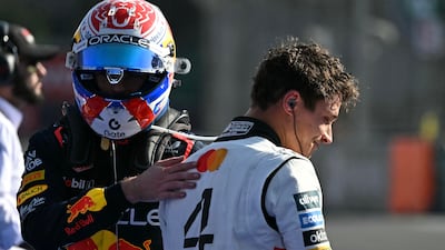 Race winner Lando Norris, right, is congratulated by Max Verstappen after the Mexico City Grand Prix. AFP