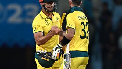 Australia's Marcus Stoinis, left, and Glenn Maxwell celebrate their five-wicket victory in the 2023 ICC Men's Cricket World Cup match against Sri Lanka at the Ekana Cricket Stadium in Lucknow on October 16, 2023. AFP