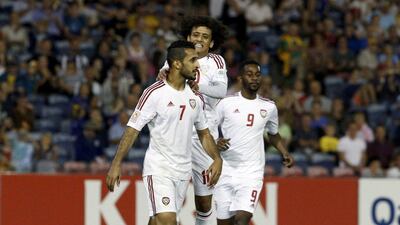 Ali Mabkhout is congratulated by Abdulrahman and Abdulaziz Haikal Haikal. Jason Reed / Reuters