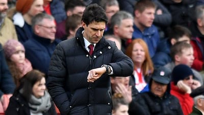 Middlesbrough manager Aitor Karanka checks his watch during the match against Stoke City at the Bet3 65 Stadium. Anthony Devlin / Reuters