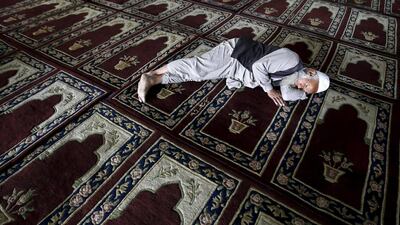 A Kashmiri Muslim man rests before having his Iftar (breaking of fast) inside Kashmir's grand mosque (Jamia Masjid) during the holy month of Ramadan in Srinagar. Danish Ismail / Reuters