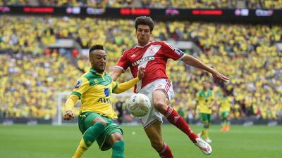 Nathan Redmond of Norwich City and George Friend of Middlesbrough battle for the ball during the Sky Bet Championship Playoff Final between Middlesbrough and Norwich City at Wembley Stadium on May 25, 2015 in London, England. (Photo by Tom Dulat/Getty Images)