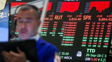 It's important not to have a 'knee-jerk reaction' to financial volatility, experts say. Bloomberg