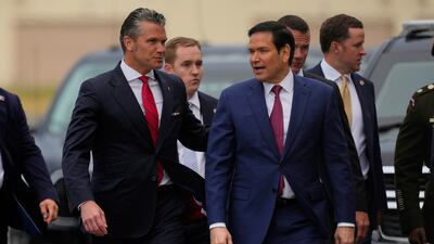 US Defence Secretary Pete Hegseth and Secretary of State Marco Rubio arrive in Anchorage. AP