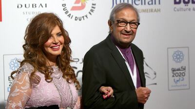 Egyptian actor Nour El-Sherif, right, and Egyptian actress Mervat Amin arrive to the opening session of the 11th Dubai International Film Festival (DIFF) in Dubai. Marwan Naamani / AFP