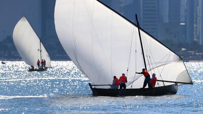A traditional dhow sailing race at the breakwater in Abu Dhabi. Ravindranath K / The National
