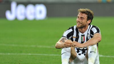 Marchisio sits on the turf after a game in 2014. Getty Images