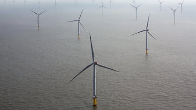 Wind turbines sit in the North Sea at the London Array offshore wind farm, a partnership between Dong Energy and Abu Dhabi-based Masdar. Masdar has just taken a stake in India's wind and solar developer Hero Future Energies. Bloomberg.