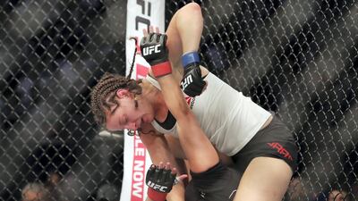 Sarah Moras made history by winning the first ever female UFC fight in Abu Dhabi. Chris Whiteoak / The National