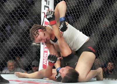 Sarah Moras made history by winning the first ever female UFC fight in Abu Dhabi. Chris Whiteoak / The National