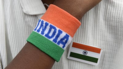 An Indian student wears his national flag and themed wristband in Secunderabad. AFP