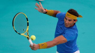 Rafael Nadal returns a ball to Kevin Anderson during their Mubadala World Tennis Championship semi-final in Abu Dhabi. EPA