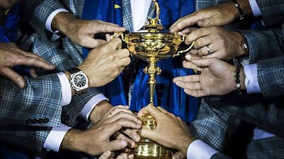 Members of Team Europe hold the Ryder Cup after the final day of the 39th Ryder Cup at the Medinah Country Club September 30, 2012 in Medinah, Illinois. Europe produced the greatest comeback in Ryder Cup history to reel in the United States and retain the trophy. AFP PHOTO/Brendan SMIALOWSKI