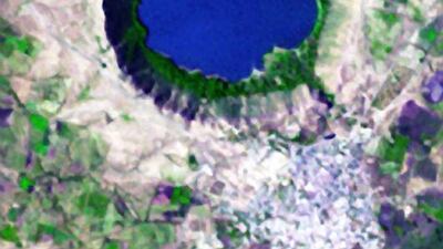What begins with Q? QuikSCAT, quakes, and quicksand. The quirky quixotic quartz pebbles in this lake with a queer shape! On November 29, 2004, the Advanced Spaceborne Thermal Emission and Reflection Radiometer on NASA’s Terra satellite acquired this image of Lonar Crater in India. Shocked quartz - minerals with an unusual structure that can only form under intense pressure - offers a clue that the lake was formed by a large meteorite. Courtesy NASA