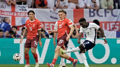 England's Bukayo Saka fires home in the 80th minute to make it 1-1. AP
