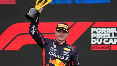 Formula One F1 - Canadian Grand Prix - Circuit Gilles Villeneuve, Montreal, Canada - June 18, 2023 Red Bull's Max Verstappen celebrates with a trophy on the podium after winning the race. Reuters