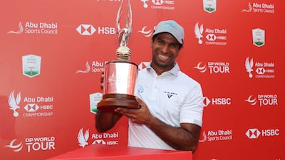 ABU DHABI, UNITED ARAB EMIRATES - NOVEMBER 09: Aaron Rai of England celebrates with the trophy following victory on day four of the Abu Dhabi HSBC Championship 2025 at Yas Links Golf Course on November 09, 2025 in Abu Dhabi, United Arab Emirates. (Photo by Andrew Redington / Getty Images)