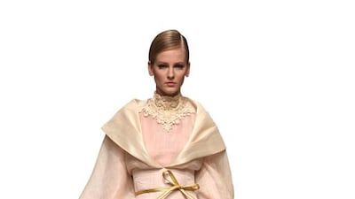 A model walks the runway at the Ezra show during Dubai Fashion Forward April 2015 at Madinat Jumeirah. Ian Gavan / Getty Images