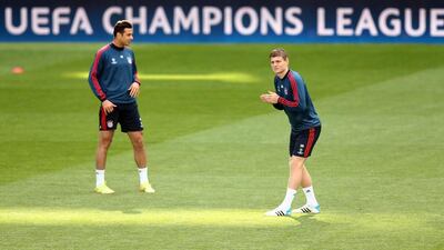 Toni Kroos (R) stretches during their FC Bayern Muenchen training at the Santiago Bernabeu Stadium ahead of the UEFA Champions League semi-final first leg match against Real Madridon April 22, 2014 in Madrid, Spain. Martin Rose/Bongarts/Getty Images