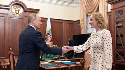 Russian President Vladimir Putin meets with Commissioner for Children's Rights Maria Lvova-Belova at the Kremlin. AFP
