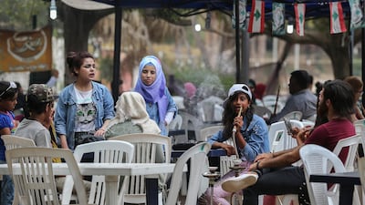 epa06962796 People sit at popular amusement park 'Horsh Beirut' to celebrate Eid Al-Adha in Beirut, Lebanon, 21 August 2018. Eid al-Adha is the holiest of the two Muslims holidays celebrated each year, it marks the yearly Muslim pilgrimage (Hajj) to visit Mecca, the holiest place in Islam. Muslims slaughter a sacrificial animal and split the meat into three parts, one for the family, one for friends and relatives, and one for the poor and needy. EPA-EFE/NABIL MOUNZER