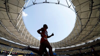 Cambodia’s Nget Phearath competes during the Men's 400-metre semi-final 2 at the 29th South East Asian Games in Kuala Lumpur, Malaysia. Vincet Thian / AP