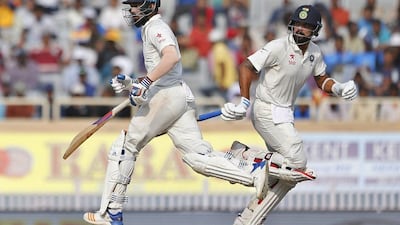 A 91-run stand between Lokesh Rahul, left, and Murali Vijay started India's reply against Australia on Day 2 in Ranchi. Aijaz Rahi / AP Photo