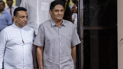 Samagi Jana Balawegaya party presidential candidate Sajith Premadasa, right, leaves the Election Commission after the election results are announced. Bloomberg